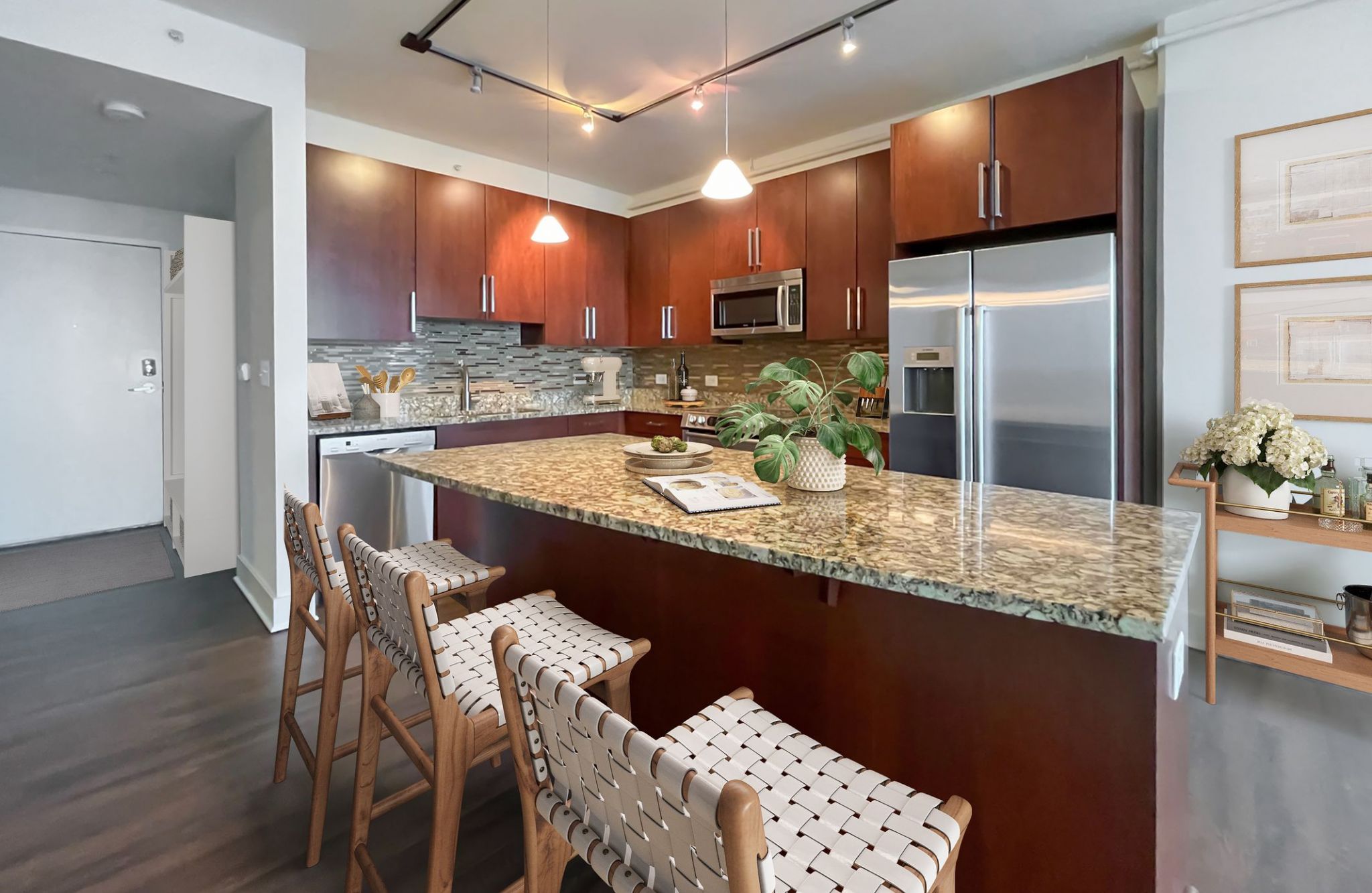 The Vue Charolotte apartment kitchen with granite countertops, stainless steel appliances, and custom cabinets 