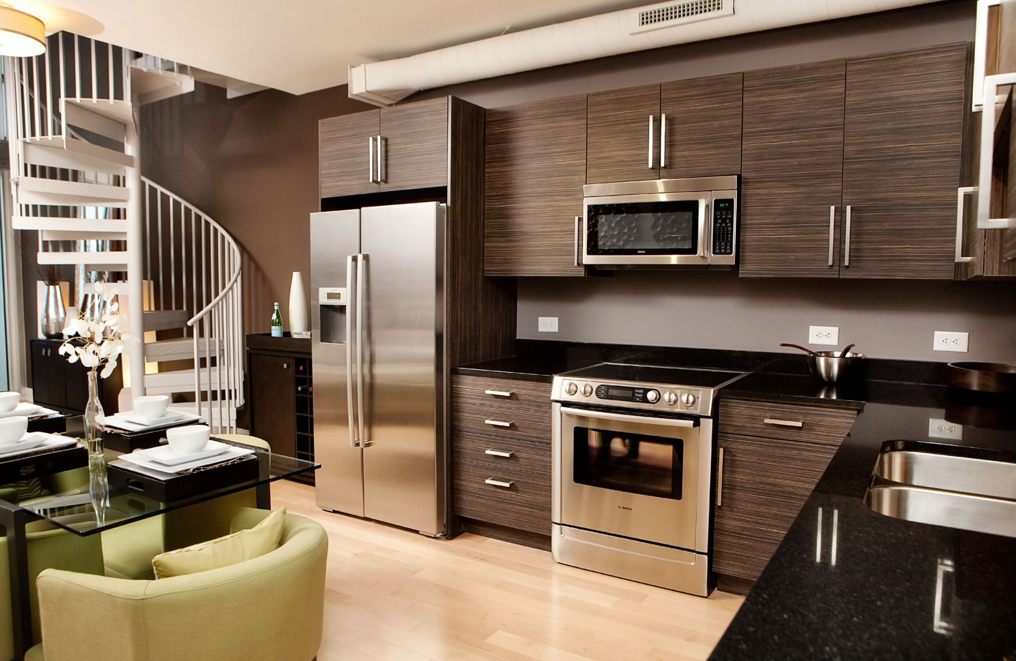 Luxury apartment kitchen with stainless steel appliances, granite countertops, and lots of storage space