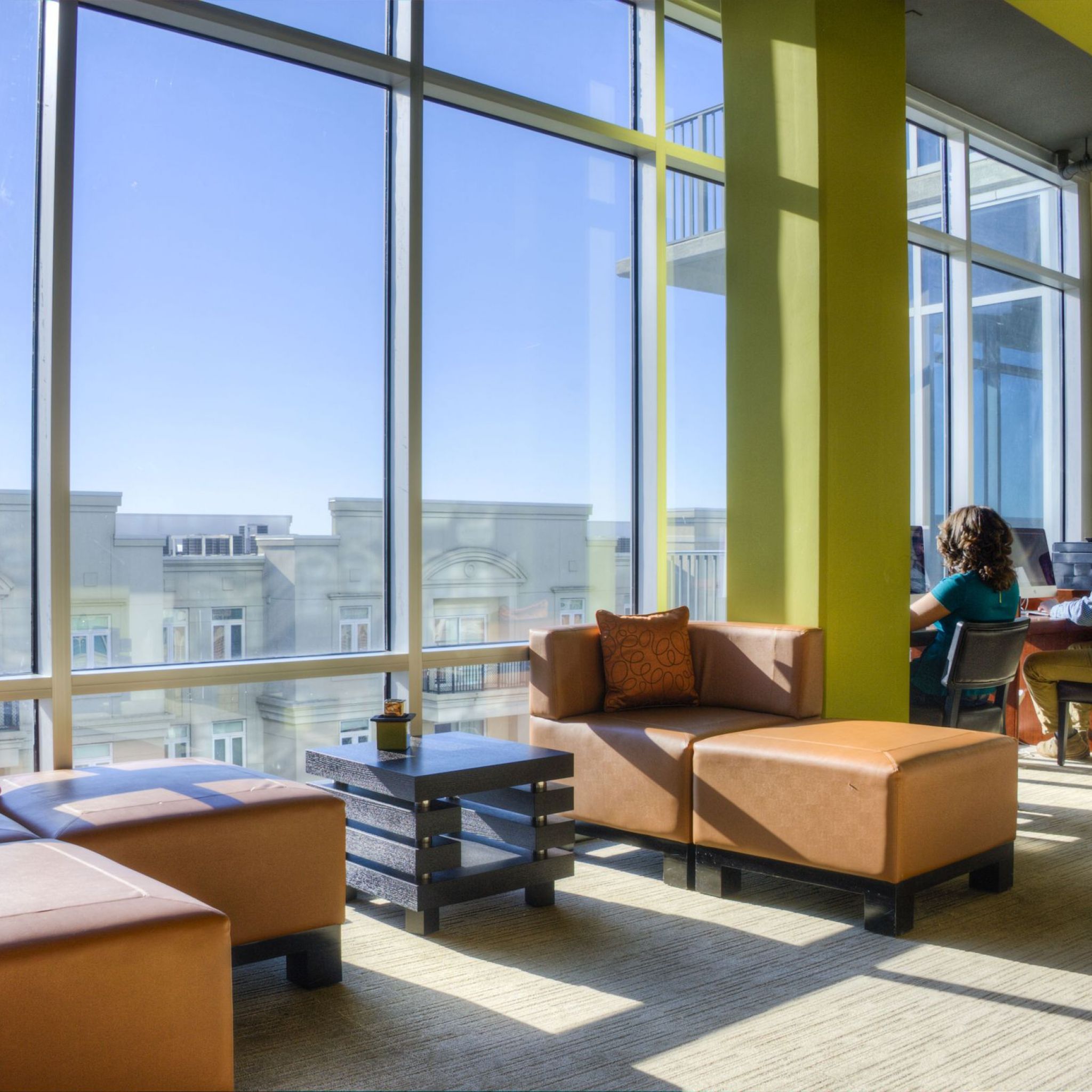 The Vue Charlotte business center and cyber cafe with work stations and floor to ceiling windows looking out over the city
